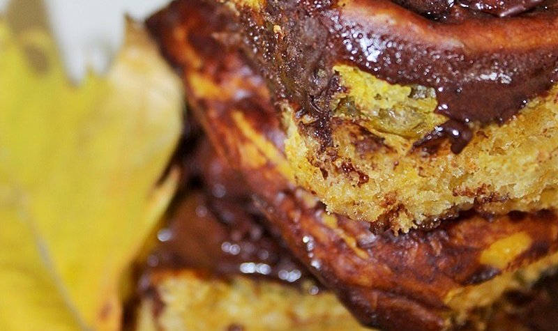 homemade pumpkin cinnamon rolls with a chocolate glaze