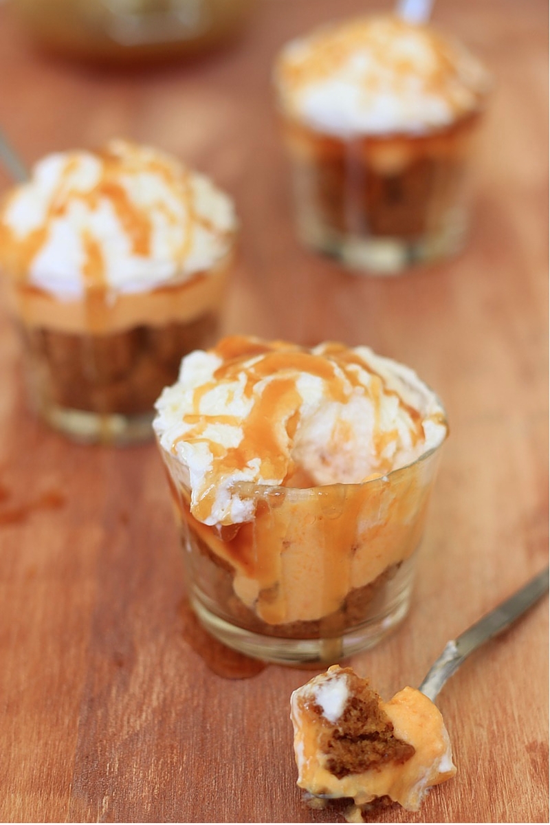 Easy Salted Caramel Pumpkin Cheesecake Parfait made with homemade salted caramel sauce, pumpkin cream cheese, pumpkin spice bundt cake and topped with freshly whipped cream.