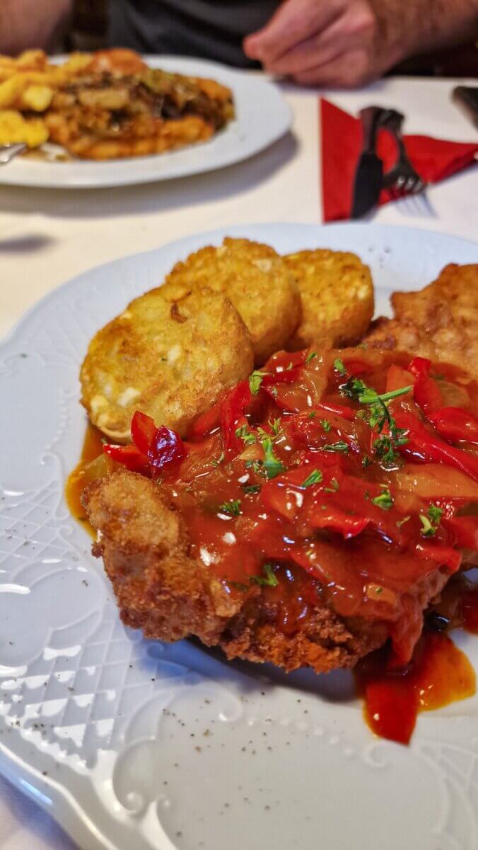 For lunch, Restaurant Café Thiesen is a great choice, offering classic German dishes in a relaxed setting with friendly service. We ordered the schnitzel, which was perfectly crisp and flavorful, followed by waffles with warm cherries for dessert, an absolute highlight.