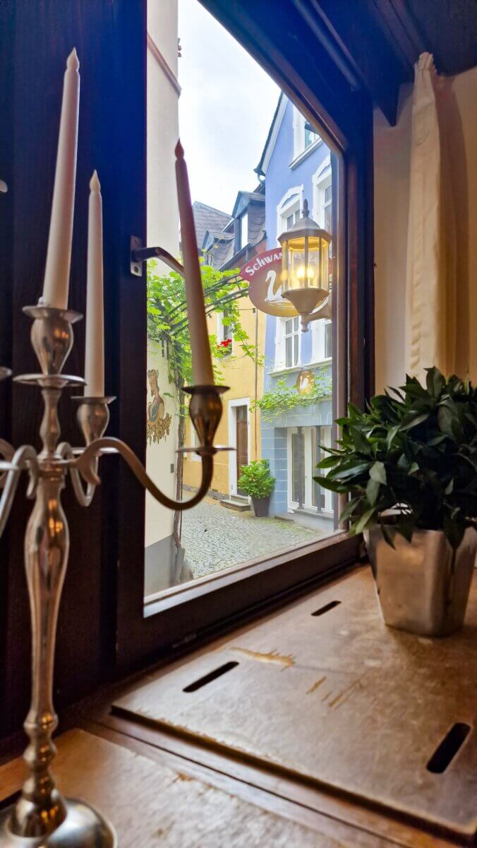 The view from inside Restaurant Café Thiesen in Bernkastel Kues out on the street.