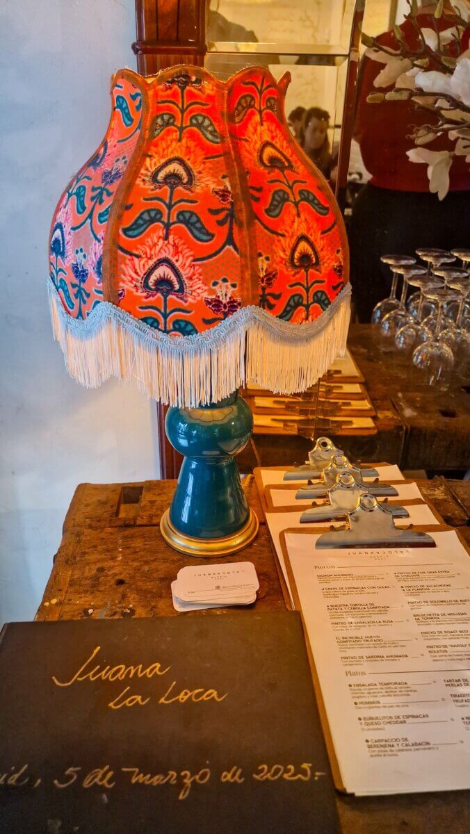 Best Places to eat in Madrid: Breakfast, Brunch, Lunch, Tapas & Dinner Guide Vintage lamp in a cozy Spanish restaurant