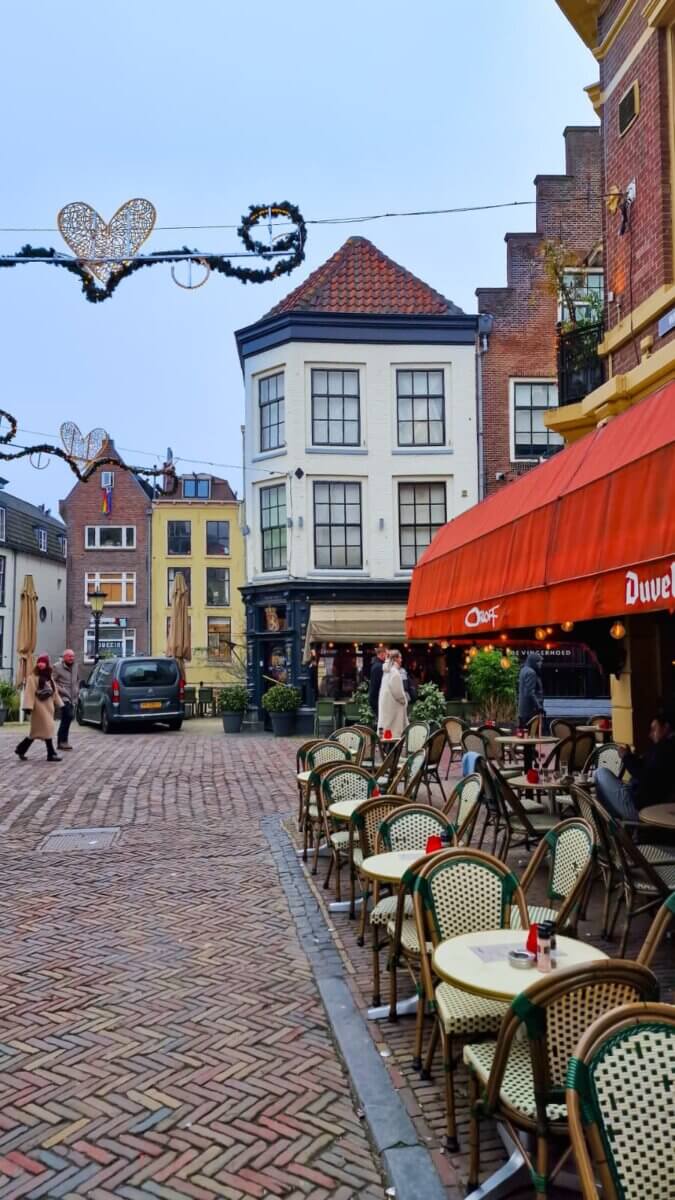 The cafe is situated on a cobblestone street near one of Utrecht's famous canals.
Utrecht is known for its medieval architecture and vibrant atmosphere.