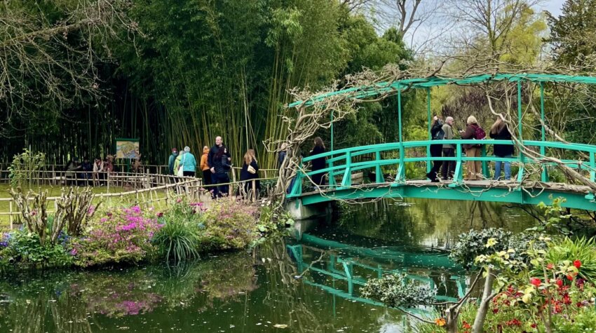 This is a moment in time capturing the Japanese bridge in the water garden of Claude Monet's house and gardens in Giverny, France.