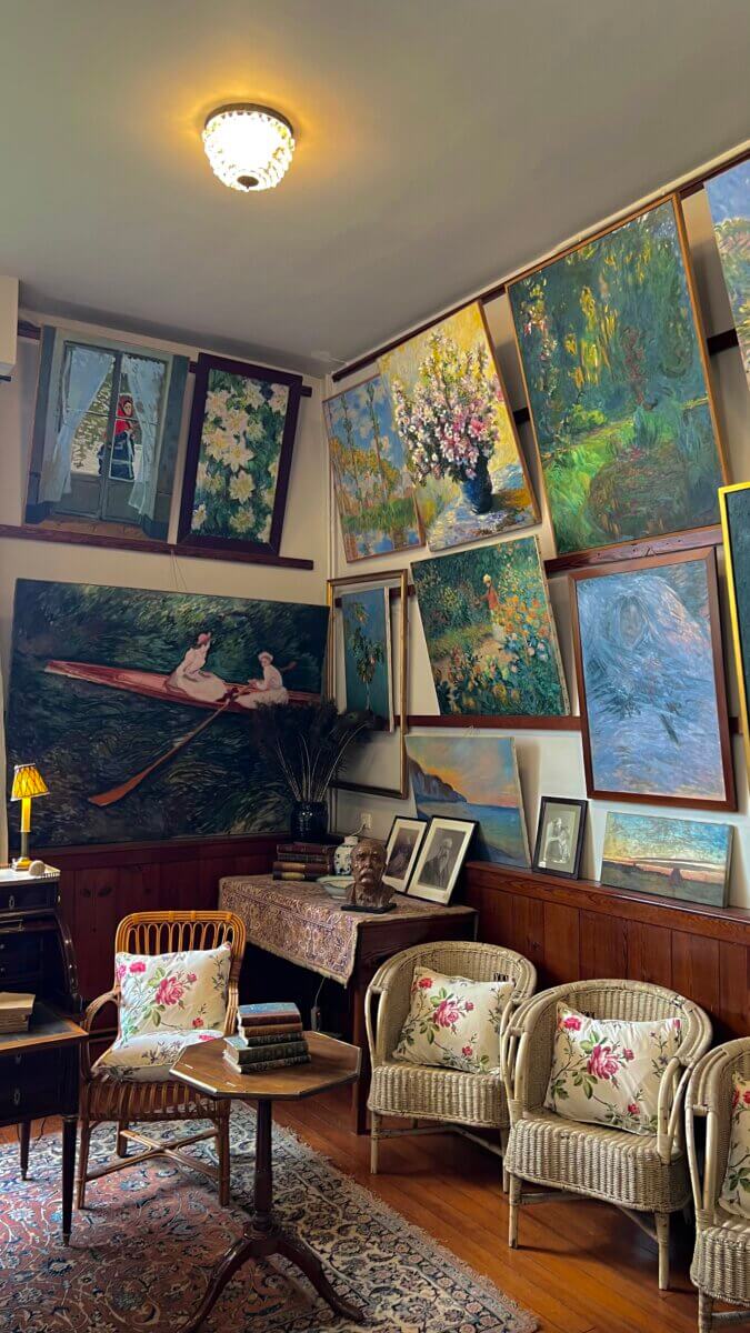 This image shows the interior of Claude Monet's house in Giverny, France, specifically a room filled with his artwork