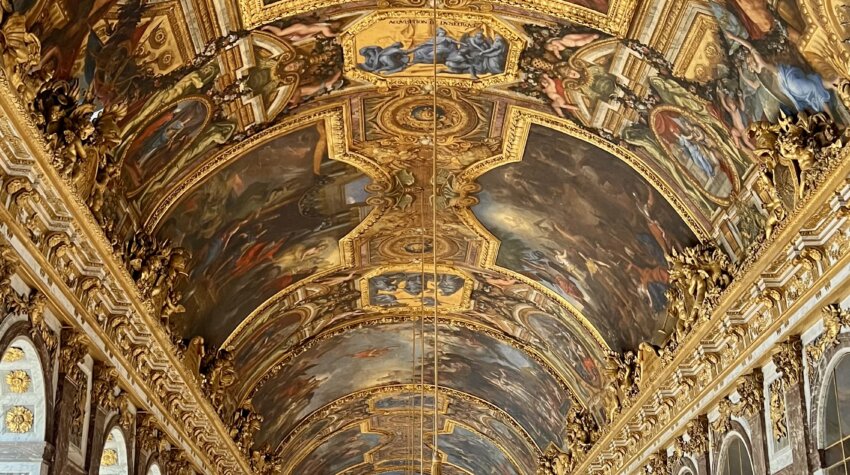 2. This image shows the Hall of Mirrors in the Palace of Versailles, a famous historical landmark located near Paris, France.