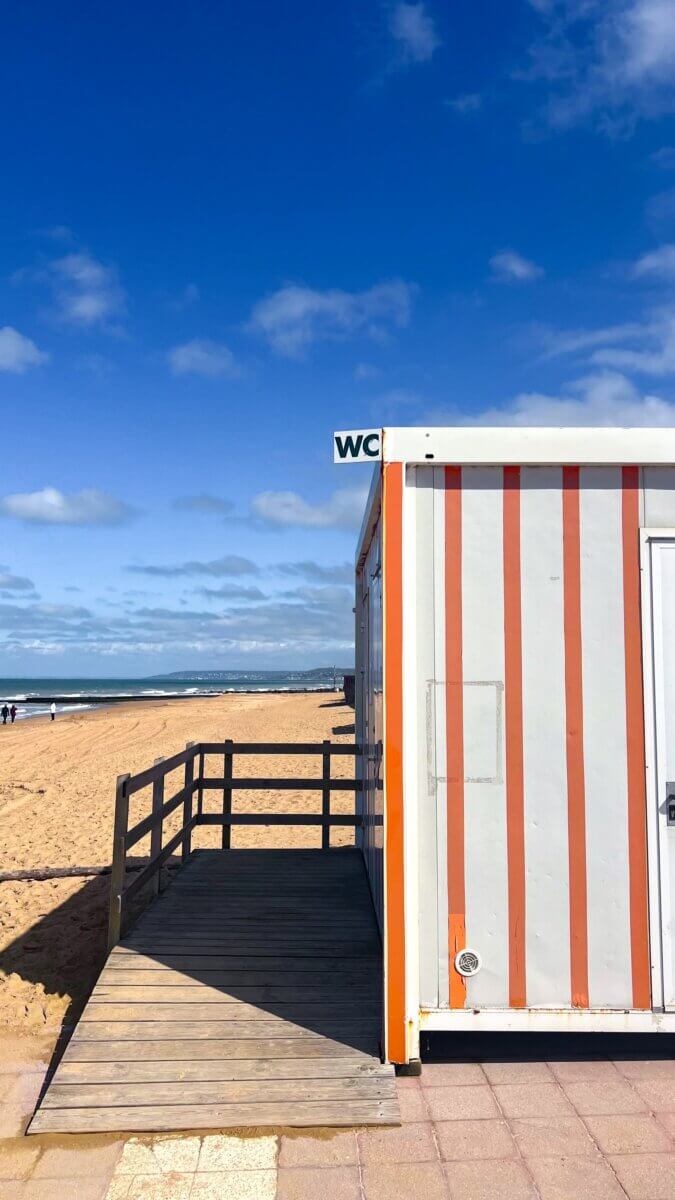 The cabin features a distinct white and orange striped pattern